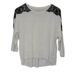 Rachel Roy cream blouse with batwing & black